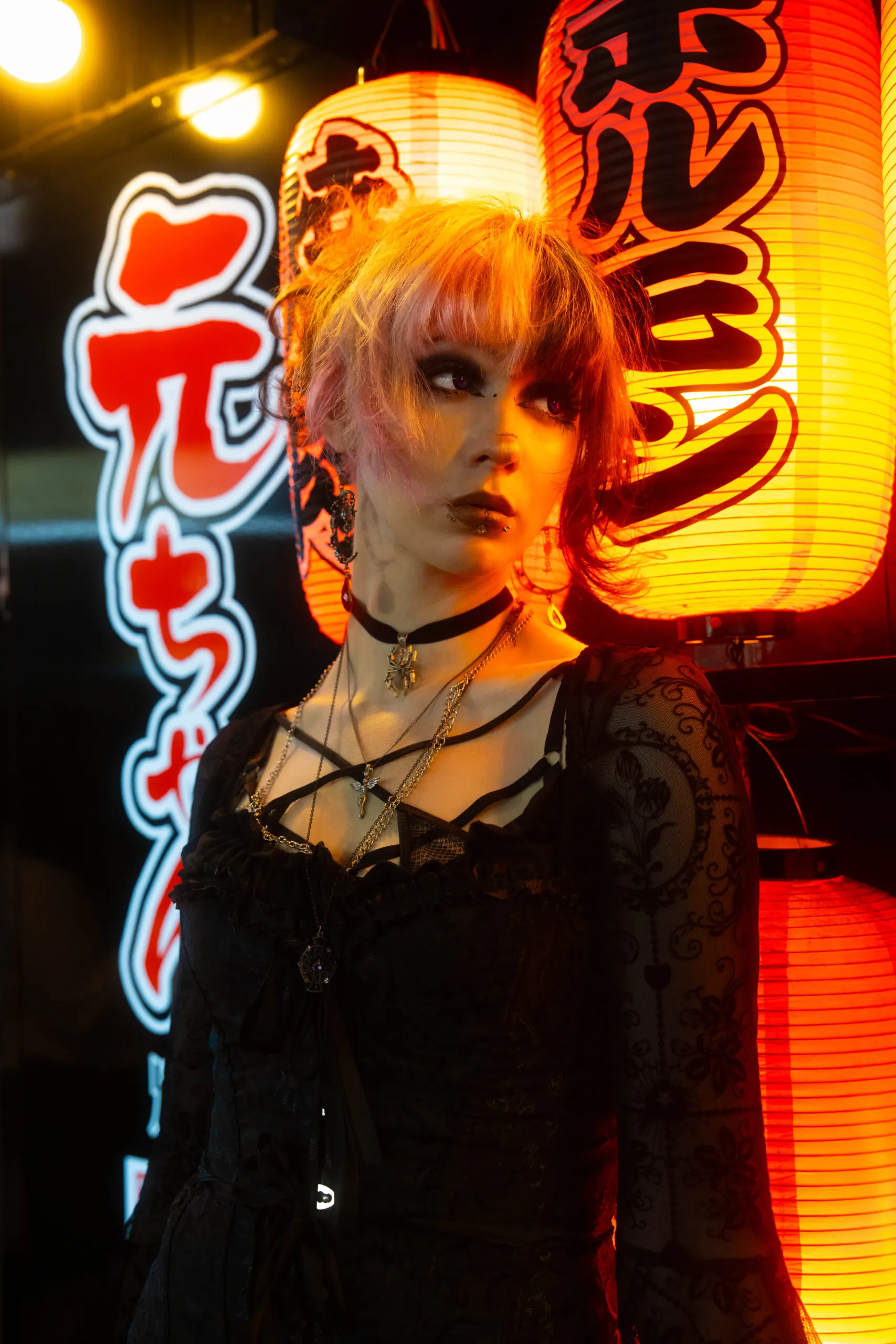 Portrait in front of glowing red Japanese lanterns