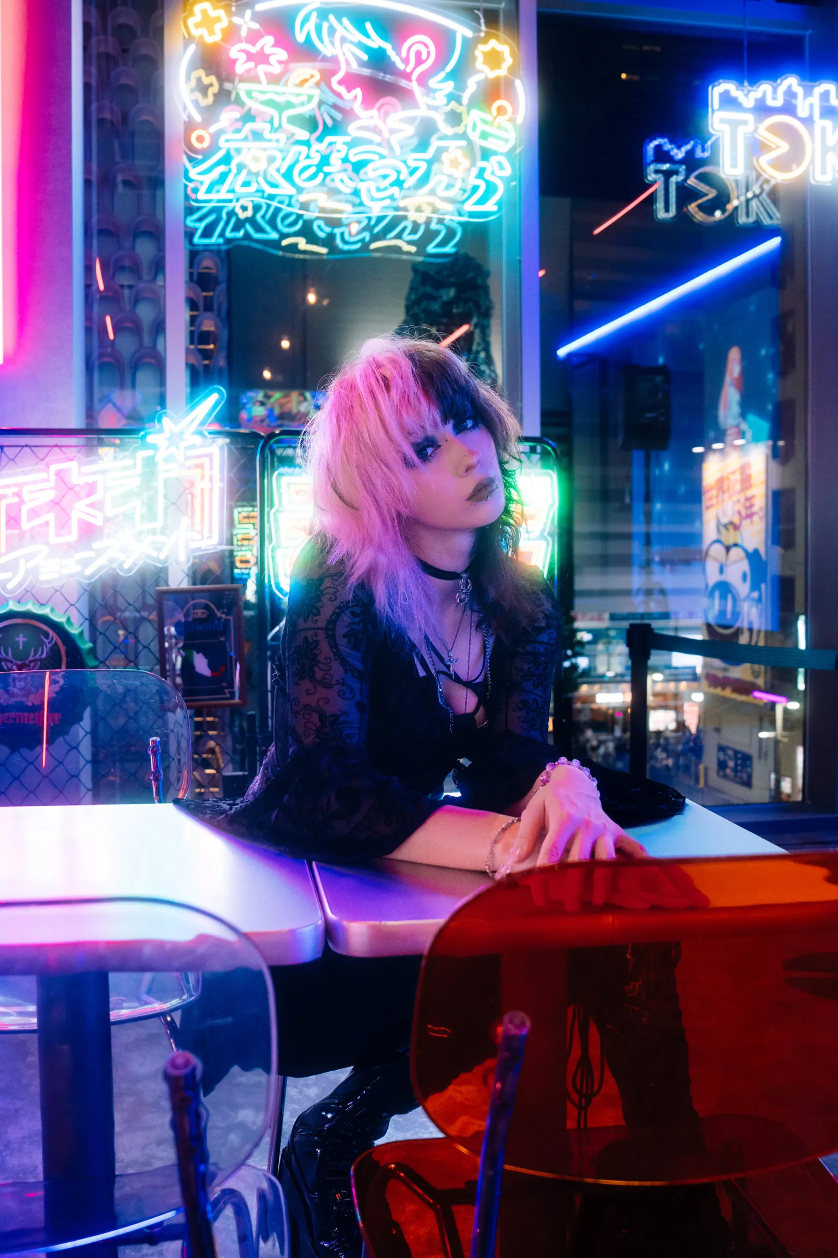 Portrait of a woman in neon light at a bar